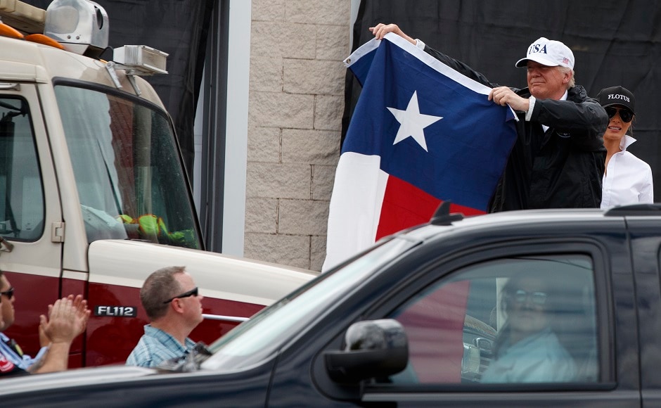 Trump told an impromptu crowd that the government is working tirelessly to bring them back and help them recover from the massive flooding and storm inflicted destruction. AP Trump told an impromptu crowd that the government is working tirelessly to bring them back and help them recover from the massive flooding and storm inflicted destruction. AP