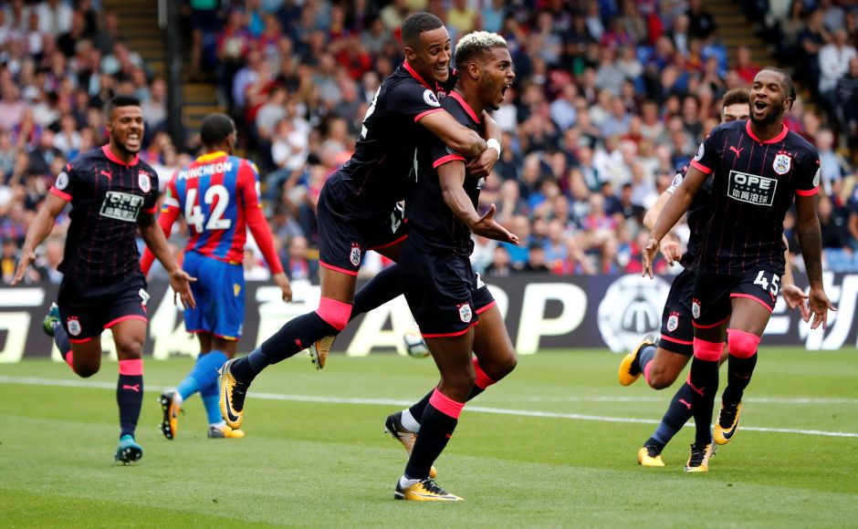 After a 45-year absence, Huddersfield Town strode back into the top flight of English football with a 3-0 win over Crystal Palace. Huddersfield Towns Steve Mounie celebrates scoring their second goal. Reuters After a 45-year absence, Huddersfield Town strode back into the top flight of English football with a 3-0 win over Crystal Palace. Huddersfield Towns Steve Mounie celebrates scoring their second goal. Reuters