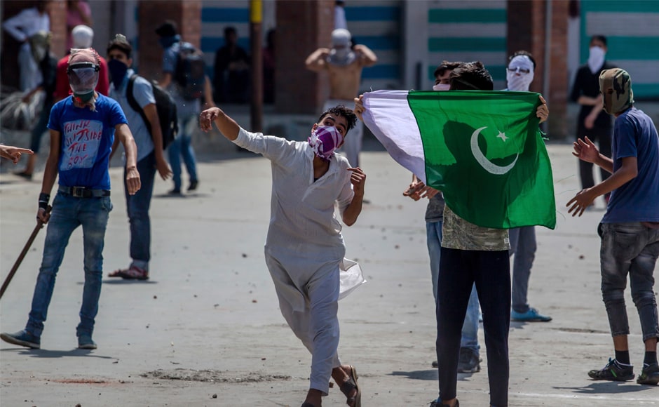 A Kashmiri protester throws a rock at government forces in Srinagar on Friday. In response, Mufti said Modi assured her to protect the Constitution's Article 35A which empowers the state legislature to declare permanent residents of the state and their privileges. AP A Kashmiri protester throws a rock at government forces in Srinagar on Friday. In response, Mufti said Modi assured her to protect the Constitution's Article 35A which empowers the state legislature to declare permanent residents of the state and their privileges. AP