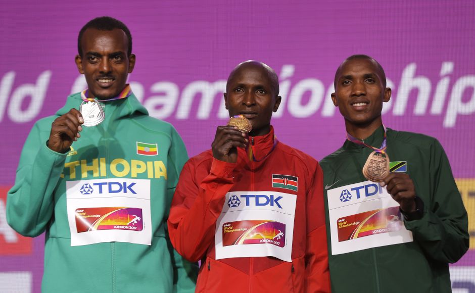 Ethiopia's Tamirat Tola, silver, Kenya's Geoffrey Kipkorir Kirui, gold, and Tanzania's Alphonse Felix Simbu, bronze, from left, during the medal ceremony for the Men's Marathon during the World Athletics Championships. AP Ethiopia's Tamirat Tola, silver, Kenya's Geoffrey Kipkorir Kirui, gold, and Tanzania's Alphonse Felix Simbu, bronze, from left, during the medal ceremony for the Men's Marathon during the World Athletics Championships. AP