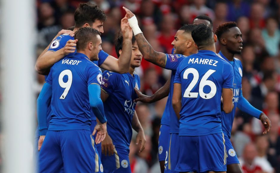 Leicester City's Shinji Okazaki celebrates scoring their first goal with teammates. Arsenal's lead lasted three minutes before Leicester's new signing Harry Maguire headed Marc Albrighton's cross from the left back into the middle and Okazaki nodded the ball past flailing Arsenal goalkeeper Petr Cech. Reuters Leicester City's Shinji Okazaki celebrates scoring their first goal with teammates. Arsenal's lead lasted three minutes before Leicester's new signing Harry Maguire headed Marc Albrighton's cross from the left back into the middle and Okazaki nodded the ball past flailing Arsenal goalkeeper Petr Cech. Reuters