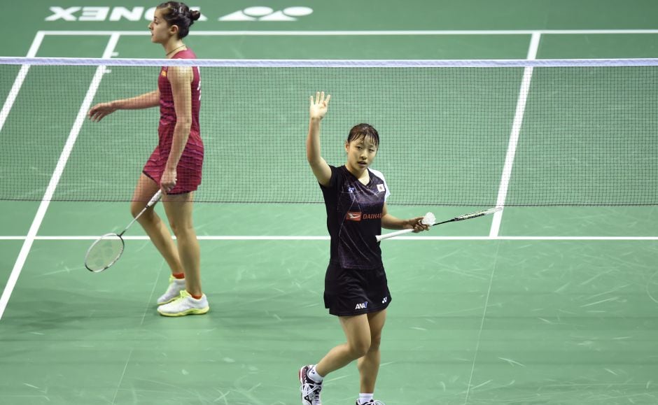 Rio Olympic gold medallist Carolina Marin’s reign came to a surprise end following a 19-21, 21-14, 15-21 defeat to Japan’s Nozomi Okuhara (R). Okuhara faces Saina Nehwal in the semi-final. AFP Rio Olympic gold medallist Carolina Marin’s reign came to a surprise end following a 19-21, 21-14, 15-21 defeat to Japan’s Nozomi Okuhara (R). Okuhara faces Saina Nehwal in the semi-final. AFP