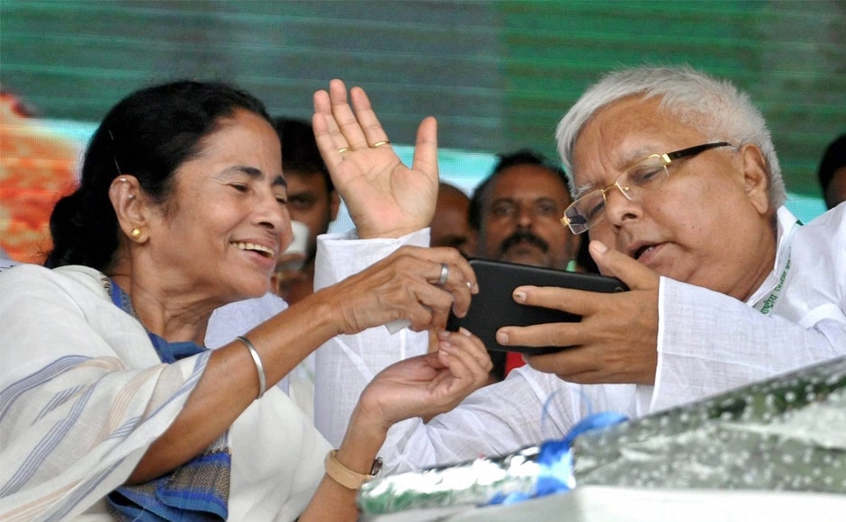 Lalu Prasad Yadav with Mamata Banerjee during the rally. Leaders of the Nationalist Congress Party, the Rashtriya Lok Dal, the Communist Party of India, the Jharkhand Mukti Morcha, the Jharkhand Vikas Morcha, the All India United Democratic Front, the DMK and others also attended the rally. PTI Lalu Prasad Yadav with Mamata Banerjee during the rally. Leaders of the Nationalist Congress Party, the Rashtriya Lok Dal, the Communist Party of India, the Jharkhand Mukti Morcha, the Jharkhand Vikas Morcha, the All India United Democratic Front, the DMK and others also attended the rally. PTI