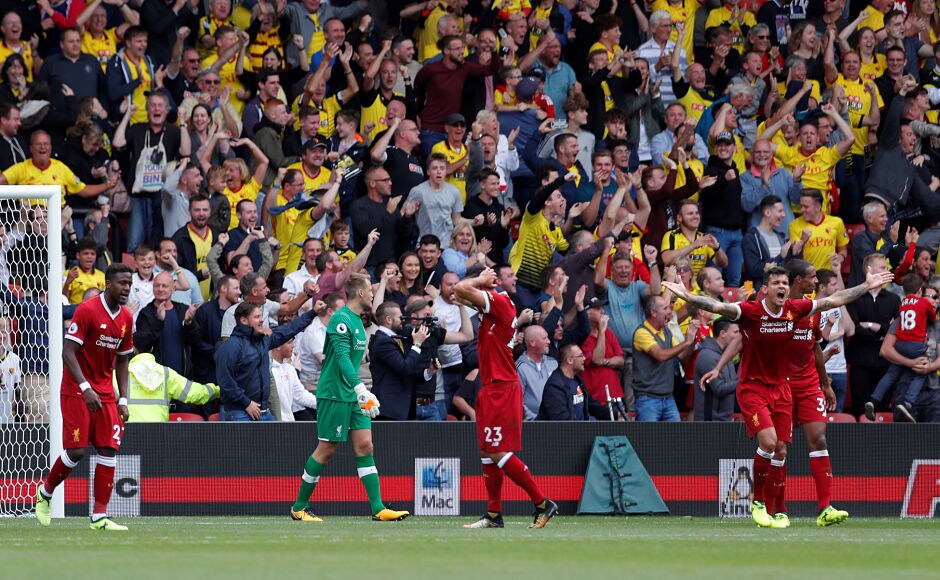 Liverpool's Simon Mignolet, Emre Can and Dejan Lovren looks dejected as Watford fans celebrate their team's third goal. Reuters Liverpool's Simon Mignolet, Emre Can and Dejan Lovren looks dejected as Watford fans celebrate their team's third goal. Reuters