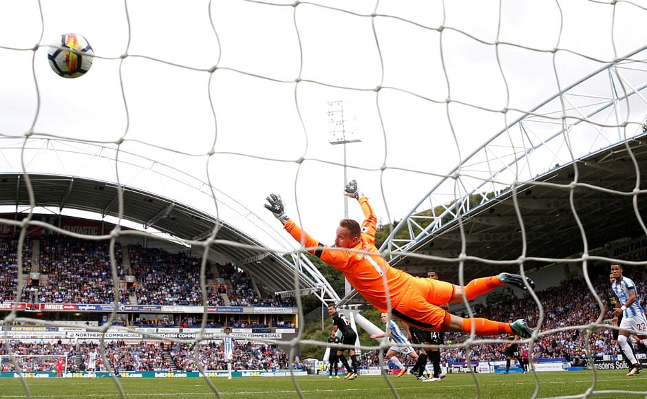 After a goal less first half, Huddersfield Towns Aaron Mooy scored a screamer past Rob Elliot for the first goal of the game in the 50th minute, which turned out to be the only goal of the match. Reuters After a goal less first half, Huddersfield Towns Aaron Mooy scored a screamer past Rob Elliot for the first goal of the game in the 50th minute, which turned out to be the only goal of the match. Reuters