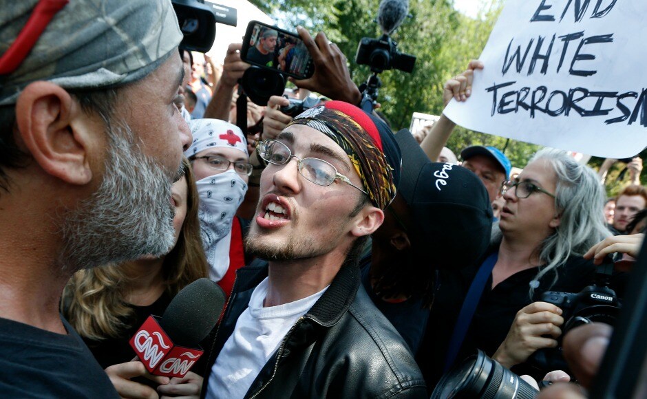 Counter protesters surrounded people leaving far right rally, shouting "shame" and "go home" and occasionally throwing plastic water bottles. AP Counter protesters surrounded people leaving far right rally, shouting "shame" and "go home" and occasionally throwing plastic water bottles. AP