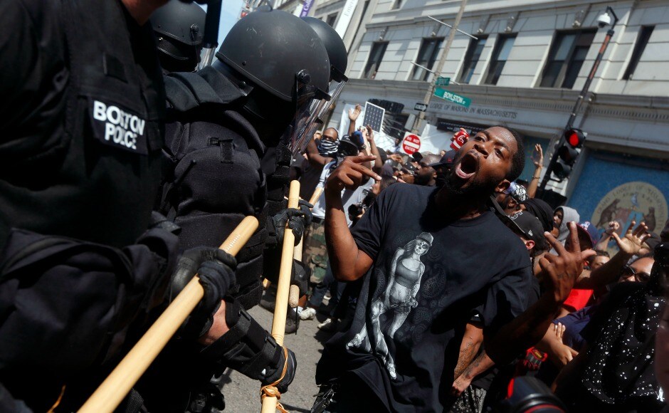 The Boston Police Department arrested thirty-three people, largely for scuffles in which some protesters threw rocks and bottles of urine at police dressed in riot gear. AP The Boston Police Department arrested thirty-three people, largely for scuffles in which some protesters threw rocks and bottles of urine at police dressed in riot gear. AP