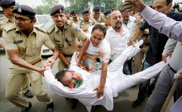 Congress supporters launch protests condemning attack on Rahul Gandhi's convoy in Gujarat Congress supporters launch protests condemning attack on Rahul Gandhi's convoy in Gujarat
