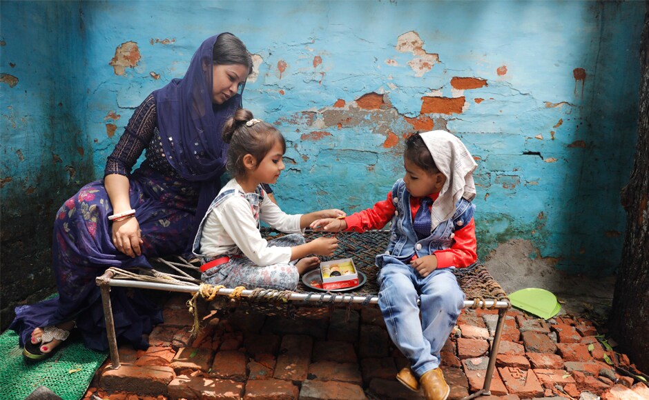 A girl ties rakhis on her brother's wrist as a symbolic gesture in Allahabad on Monday. Raksha Bandhan is a time to celebrate the 'bond of protection' between a brother and his sister. AP A girl ties rakhis on her brother's wrist as a symbolic gesture in Allahabad on Monday. Raksha Bandhan is a time to celebrate the 'bond of protection' between a brother and his sister. AP