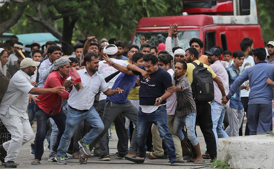 Dera supporters manhandle a mediaperson. Five people also attempted suicide as the clashes spread across Punjab, Uttar Pradesh and Delhi. PTI Dera supporters manhandle a mediaperson. Five people also attempted suicide as the clashes spread across Punjab, Uttar Pradesh and Delhi. PTI