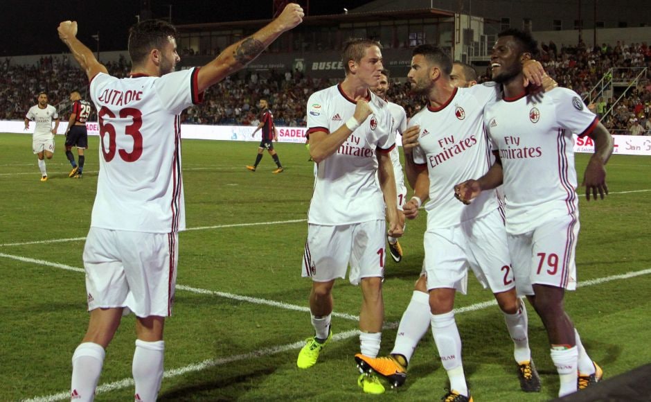 AC Milan's Frank Kessie (R) celebrates with teammates after scoring. After only four minutes, Federico Ceccherini brought down Patrick Cutrone and, after consulting with the VAR, the referee sent off the defender and awarded the visitors a penalty, which Franck Kessie converted for his first goal for his new club. AP AC Milan's Frank Kessie (R) celebrates with teammates after scoring. After only four minutes, Federico Ceccherini brought down Patrick Cutrone and, after consulting with the VAR, the referee sent off the defender and awarded the visitors a penalty, which Franck Kessie converted for his first goal for his new club. AP