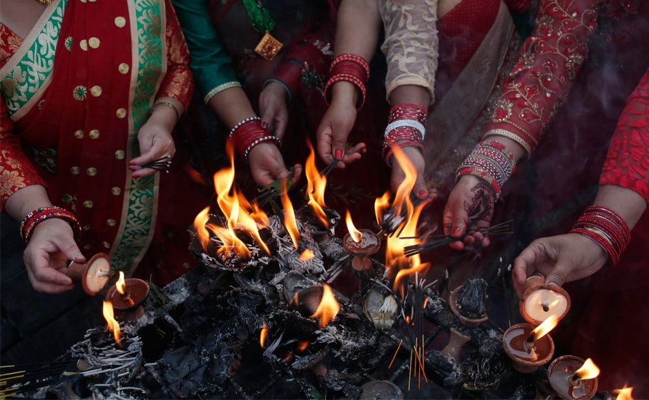 Women offer prayers lighting incense sticks at the Pashupatinath Temple. Over 3 lakh devotees are expected to visit the temple. All four doors of the temple are open from 3 am onwards. AP Women offer prayers lighting incense sticks at the Pashupatinath Temple. Over 3 lakh devotees are expected to visit the temple. All four doors of the temple are open from 3 am onwards. AP