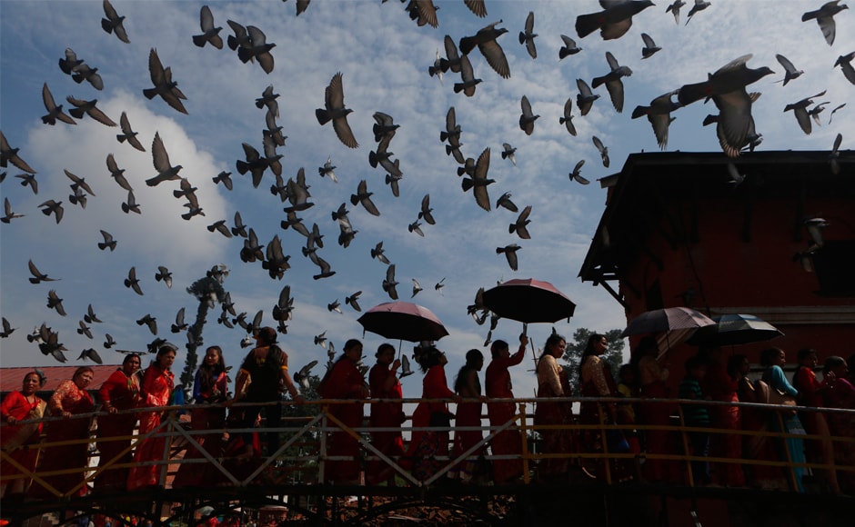 Women stand in a queue to enter the Pashupatinath Temple to offer their prayers. At least 5,000 cops from the Nepal Police and the Armed Police Force have been deployed to ensure the security of devotees. The entire temple premises is under surveillance of 30 CCTV cameras. AP Women stand in a queue to enter the Pashupatinath Temple to offer their prayers. At least 5,000 cops from the Nepal Police and the Armed Police Force have been deployed to ensure the security of devotees. The entire temple premises is under surveillance of 30 CCTV cameras. AP