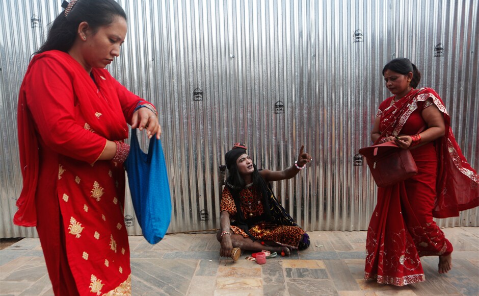 A man dressed as Lord Shiva sits and asks for alms from the devotees during the Teej celebrations in Kathmandu. The festival is traditionally celebrated to honour Goddess Parvati's union with Lord Shiva. AP A man dressed as Lord Shiva sits and asks for alms from the devotees during the Teej celebrations in Kathmandu. The festival is traditionally celebrated to honour Goddess Parvati's union with Lord Shiva. AP