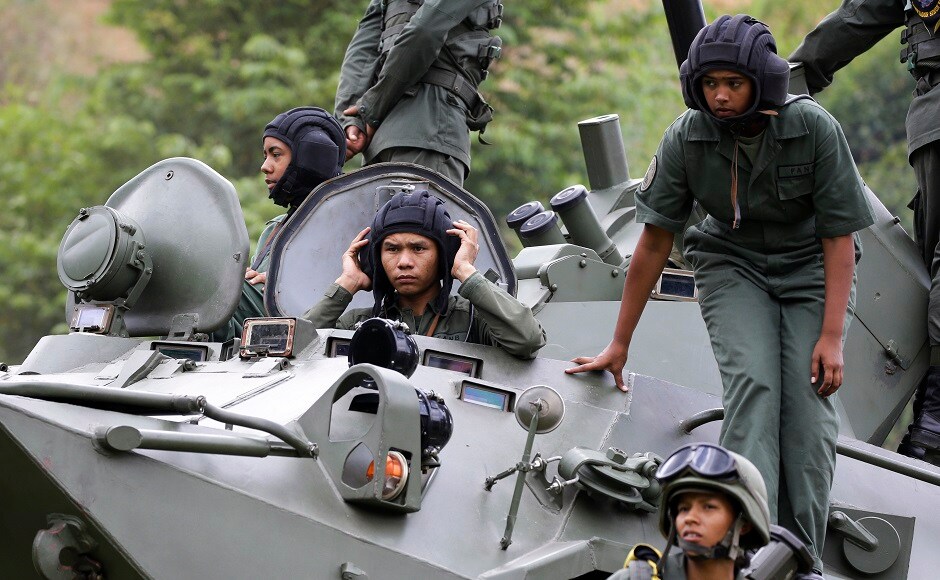 Civilians were also taught to shoot rifles, fire missiles and engage in hand-to-hand combat during the two day military exercise in defiance of United States sanctions. AP Civilians were also taught to shoot rifles, fire missiles and engage in hand-to-hand combat during the two day military exercise in defiance of United States sanctions. AP
