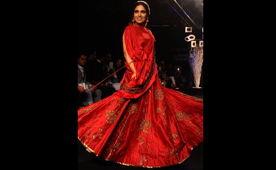 Bhumi Pednekar looked every inch of a classic, Indian bride with a modern touch, as she walked the ramp for Ruceru. Image from AFP. Bhumi Pednekar looked every inch of a classic, Indian bride with a modern touch, as she walked the ramp for Ruceru. Image from AFP.