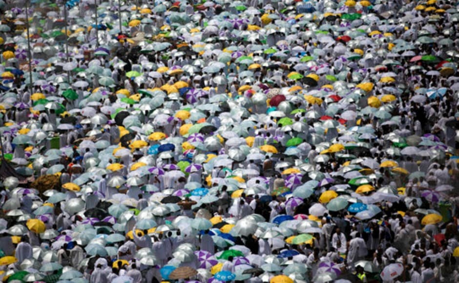 Muslim pilgrims hold umbrellas as they attend afternoon prayers outside Namirah mosque. Thousands, who would normally make the journey from neighbouring Qatar, were absent apart from a few dozen because of the diplomatic crisis in the Gulf. AP Muslim pilgrims hold umbrellas as they attend afternoon prayers outside Namirah mosque. Thousands, who would normally make the journey from neighbouring Qatar, were absent apart from a few dozen because of the diplomatic crisis in the Gulf. AP
