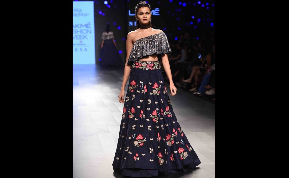 The lotus is the common motif that runs through the whole collection, brightening up dark shades of navy blue. The lotus is the common motif that runs through the whole collection, brightening up dark shades of navy blue.