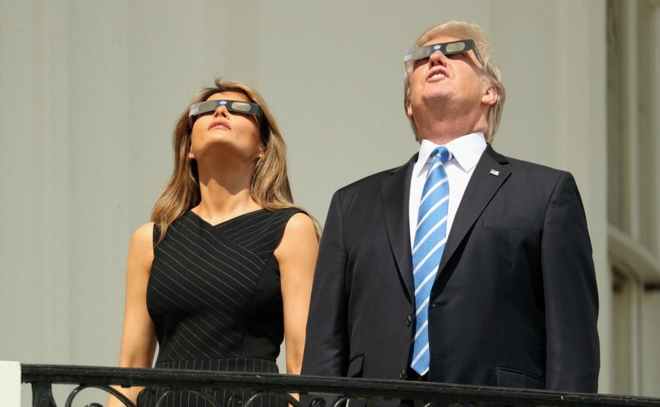President Donald Trump and First Lady Melania Trump wore protective glasses to watch the eclipse from the White House. AP President Donald Trump and First Lady Melania Trump wore protective glasses to watch the eclipse from the White House. AP