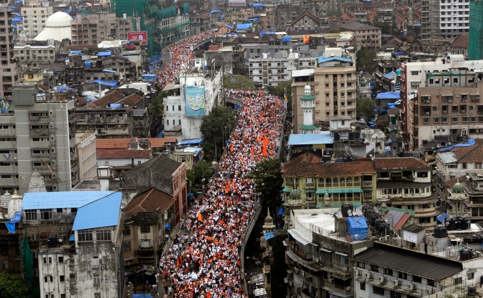 Wearing saffron caps and holding flags, the protesters marched towards the protest venue via JJ flyover in south Mumbai which had been closed for vehicular traffic. AP Wearing saffron caps and holding flags, the protesters marched towards the protest venue via JJ flyover in south Mumbai which had been closed for vehicular traffic. AP