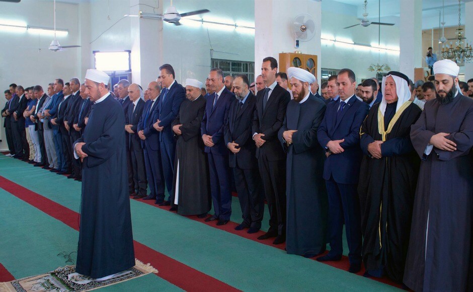 The official Facebook page of Syrian Presidency shows Syrian President Bashar Assad, fifth from right, praying on the first day of Eid al-Adha at Bilal mosque in the western Qalamoun town of Qarat. AP The official Facebook page of Syrian Presidency shows Syrian President Bashar Assad, fifth from right, praying on the first day of Eid al-Adha at Bilal mosque in the western Qalamoun town of Qarat. AP