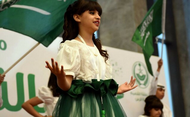 The programme featured perfomers decked up mainly in green and white, symbolising the colours of the kingdom's national flag. AP The programme featured perfomers decked up mainly in green and white, symbolising the colours of the kingdom's national flag. AP