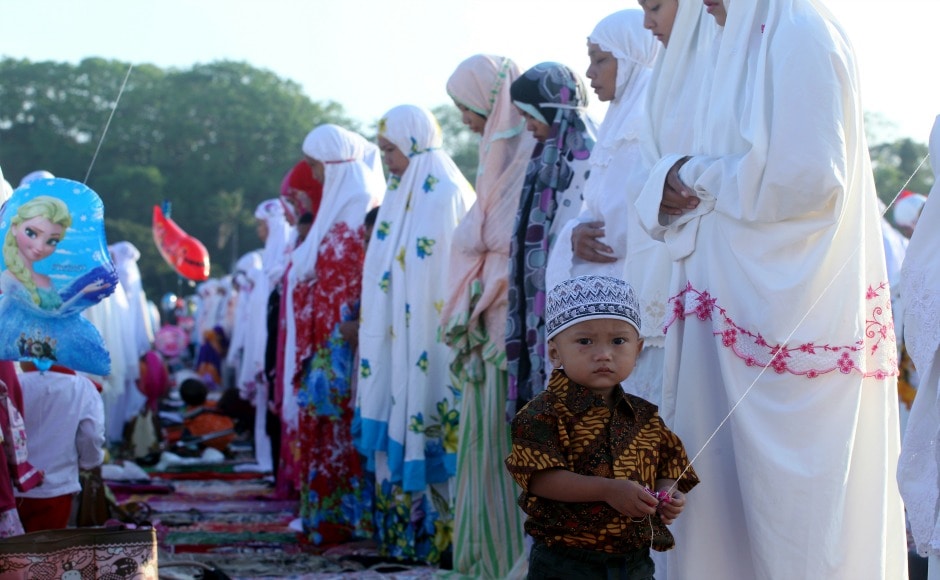 The final days of Hajj coincide with the Eid al-Adha holiday to commemorate Ibrahim's test of faith. Muslims slaughter livestock and distribute the meat to the poor. A Muslim boy stands with women offering prayers to mark Eid al-Adha holiday on a field in Bali, Indonesia. AP The final days of Hajj coincide with the Eid al-Adha holiday to commemorate Ibrahim's test of faith. Muslims slaughter livestock and distribute the meat to the poor. A Muslim boy stands with women offering prayers to mark Eid al-Adha holiday on a field in Bali, Indonesia. AP