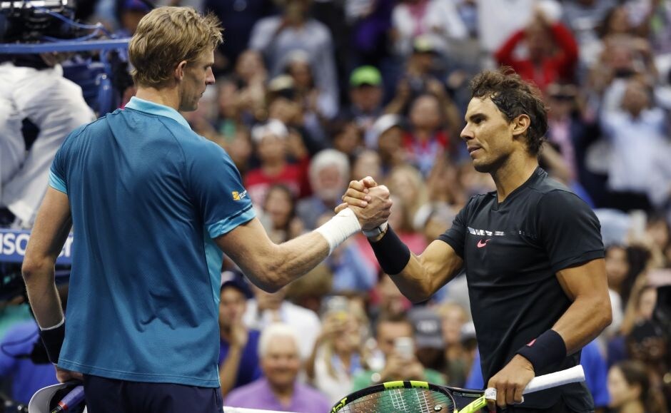 Rafael Nadal shakes hands with Kevin Anderson at the net after winning the men's singles final. This win takes Nadal to 16 Grand Slam titles in his career. AP Rafael Nadal shakes hands with Kevin Anderson at the net after winning the men's singles final. This win takes Nadal to 16 Grand Slam titles in his career. AP