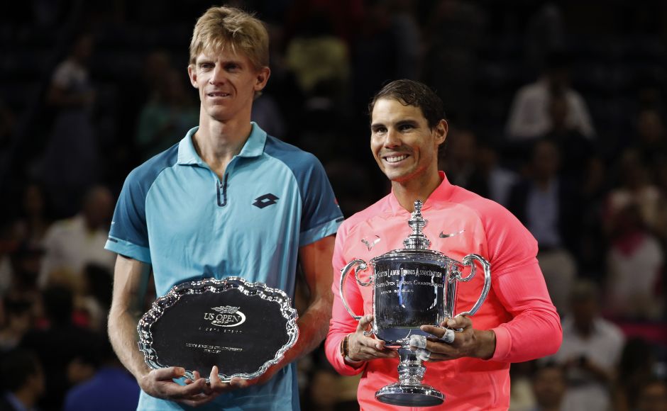 Rafael Nadal, right, poses for photos with Kevin Anderson with their respective trophies. This is the fourth year that Nadal has won at least two Grand Slam titles. AP Rafael Nadal, right, poses for photos with Kevin Anderson with their respective trophies. This is the fourth year that Nadal has won at least two Grand Slam titles. AP