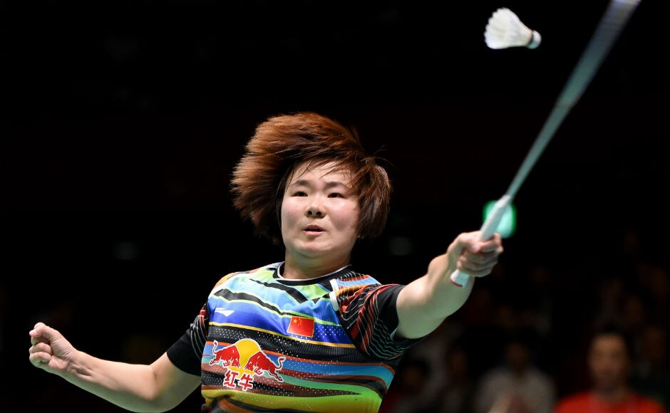 China's He Bingjiao hits a return against Carolina Marin of Spain during the women's singles final match. AFP Viktor Axelsen, Carolina Marin win singles titles at Japan Open Superseries