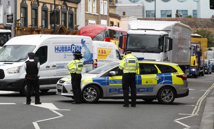 A police vehicle blocks traffic after an explosion at a train at Parsons Green subway station. AP