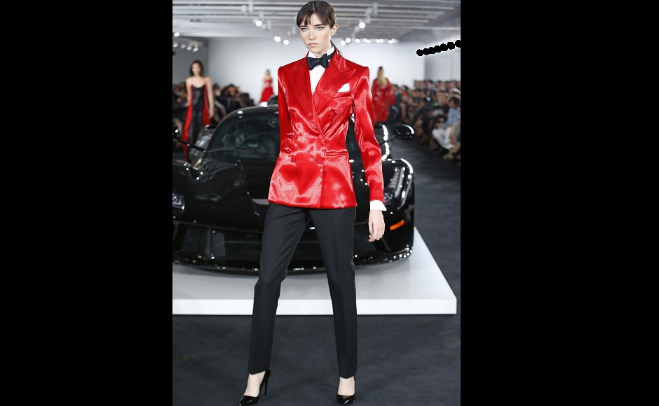 Another model poses in a red bespoke suit, at Ralph Lauren's fashion show. Image from AP. Another model poses in a red bespoke suit, at Ralph Lauren's fashion show. Image from AP.