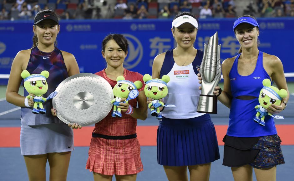 Top seeds Martina Hingis and Chan Yung-Jan marched to their third consecutive title at Wuhan beating Japan's Shuko Aoyama and China's Yang Zhaoxuan 7-6(5), 3-6, 10-4. AFP Top seeds Martina Hingis and Chan Yung-Jan marched to their third consecutive title at Wuhan beating Japan's Shuko Aoyama and China's Yang Zhaoxuan 7-6(5), 3-6, 10-4. AFP