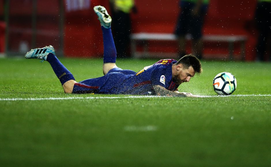 Lionel Messi falls during the La Liga match between Girona and FC Barcelona at the Montilivi stadium. Messi scored nine goals in the first five rounds of La Liga this season. AP Barcelona's Luiz Suarez scores in 100th La Liga appearance, Real Madrid win on Cristiano Ronaldo's return