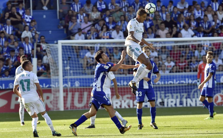 Real Madrid's Raphael Varane heads the ball past Alaves's Manu Garcia. Even Cristiano Ronaldo hit the goal-frame twice in the second half as the Madrid forward seeking his first goal this season. AP Barcelona's Luiz Suarez scores in 100th La Liga appearance, Real Madrid win on Cristiano Ronaldo's return