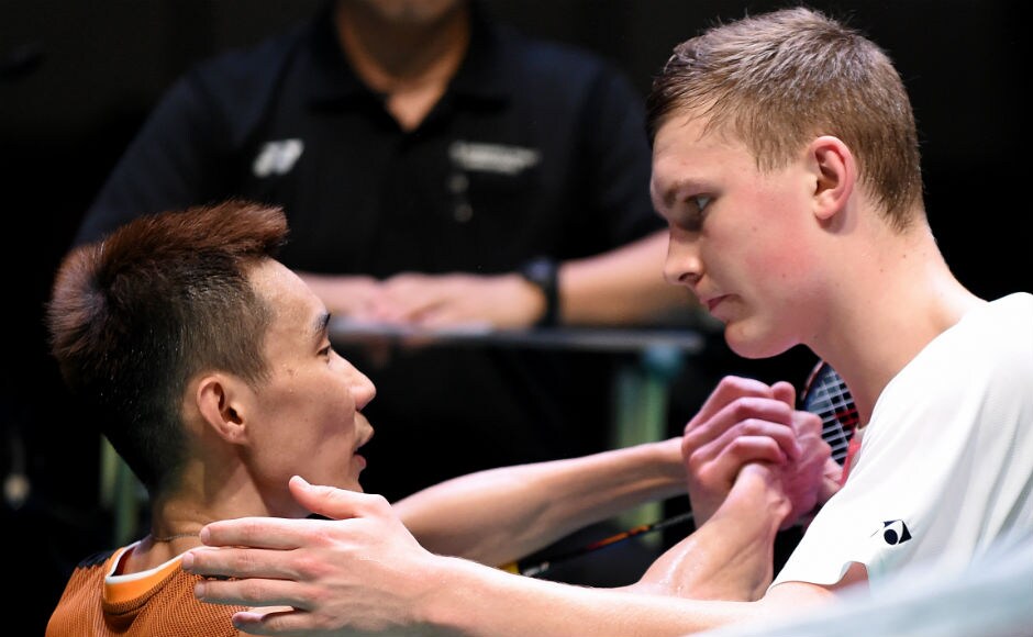 Viktor Axelsen (R) of Denmark shakes hands with six-time Japan Open winner Lee Chong Wei (L) after his victory in the men's singles final match. AFP Viktor Axelsen, Carolina Marin win singles titles at Japan Open Superseries