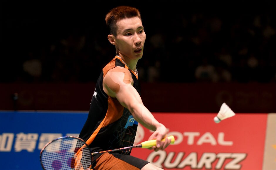 Lee Chong Wei of Malaysia hits a return against Viktor Axelsen in the final of the men's singles. AFP Viktor Axelsen, Carolina Marin win singles titles at Japan Open Superseries