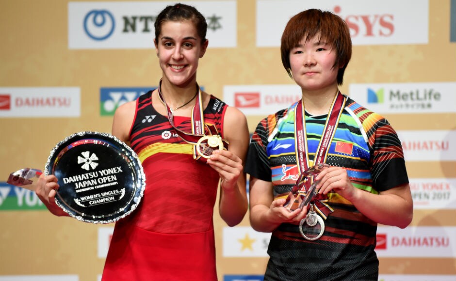 2016 Rio Olympics champion Carolina Marin poses with He Bingjiao of China after winning gold at the Japan Open Superseries in Tokyo. AFP Viktor Axelsen, Carolina Marin win singles titles at Japan Open Superseries
