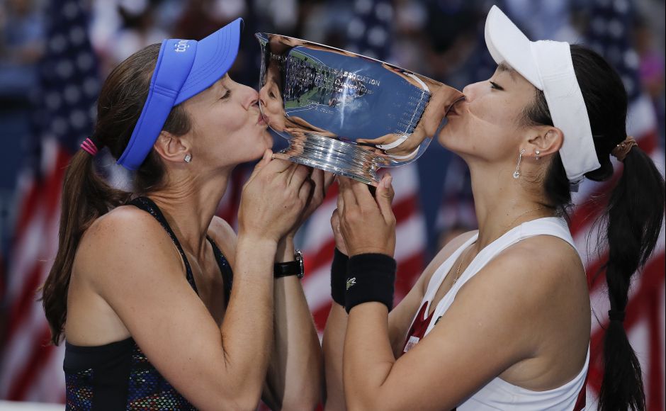 Martina Hingis, of Switzerland, left, and Chan Yung-Jan, of Taiwan, hold up the women's doubles championship trophy after beating Katerina Siniakova, of Czech Republic, and Lucie Hradecka, of the Czech Republic, in the women's doubles final. Hingis also won the mixed doubles title with Jamie Murray to capture her 25th career Grand Slam crwon. AP Martina Hingis, of Switzerland, left, and Chan Yung-Jan, of Taiwan, hold up the women's doubles championship trophy after beating Katerina Siniakova, of Czech Republic, and Lucie Hradecka, of the Czech Republic, in the women's doubles final. Hingis also won the mixed doubles title with Jamie Murray to capture her 25th career Grand Slam crwon. AP