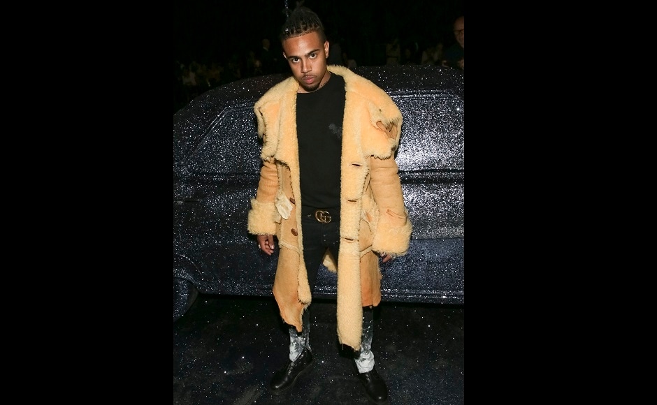 Rapper Vic Mensa also attended the show, dressed in black and yellow. Image from AP. Rapper Vic Mensa also attended the show, dressed in black and yellow. Image from AP.
