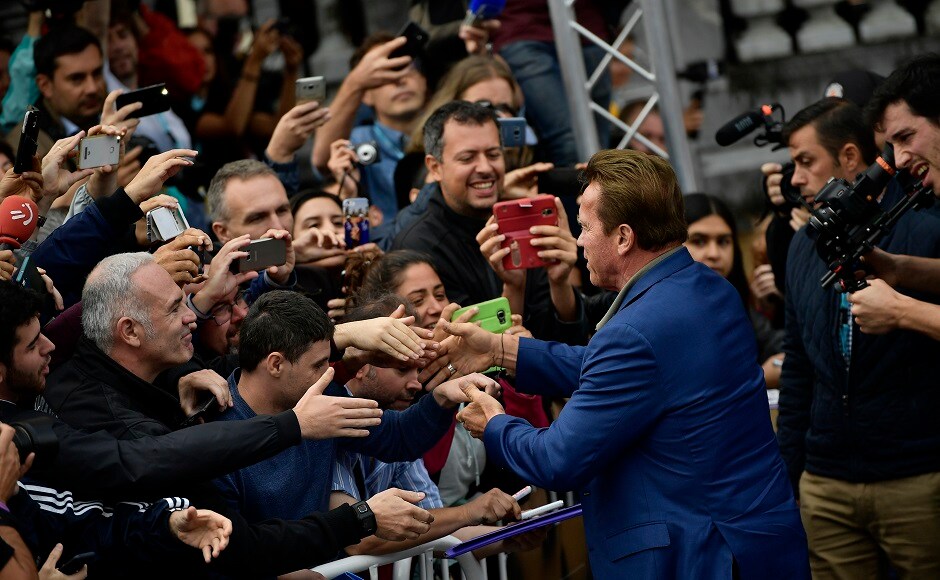 Arnold Schwarzenegger greets fans. Image from AP Arnold Schwarzenegger promotes Wonders Of The Sea at San Sebastian Film Festival, greets fans