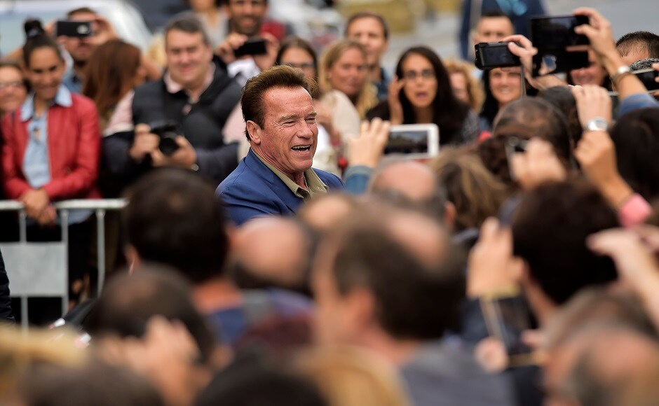Arnold Schwarzenegger greets fans as he arrives to promote the film Wonders Of The Sea. Image from AP Arnold Schwarzenegger promotes Wonders Of The Sea at San Sebastian Film Festival, greets fans