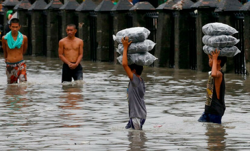 Five other people remain missing after flash floods swept away a house beside a swollen river in Laguna province, disaster relief officials said. AP Five other people remain missing after flash floods swept away a house beside a swollen river in Laguna province, disaster relief officials said. AP