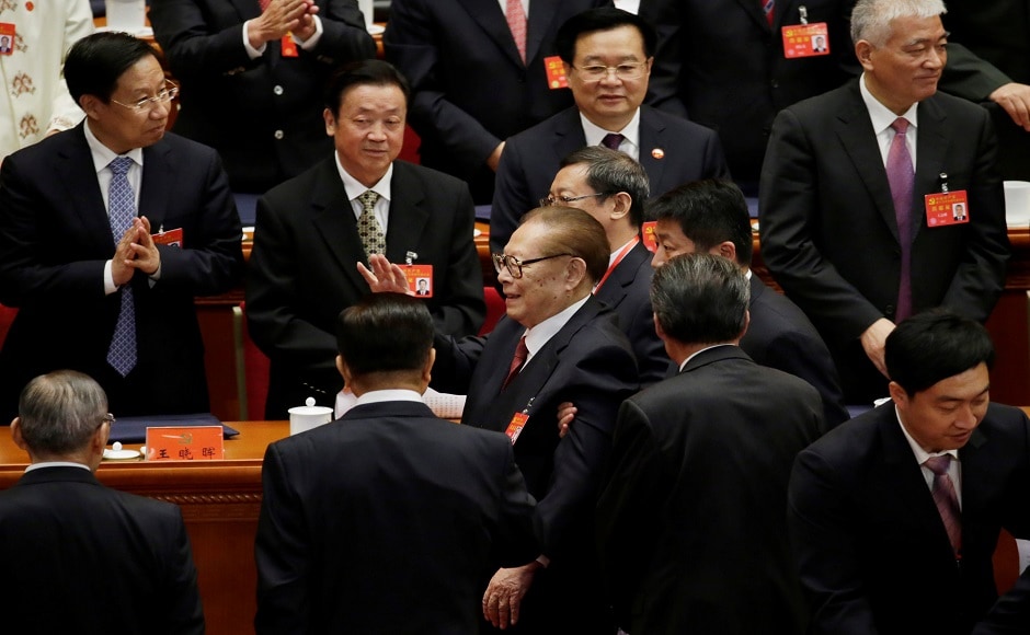 Former Chinese president Jiang Zemin (C) waves as he leaves after the opening session of the Congress at the Great Hall of the People in Beijing. Reuters Communist Party of China holds 19th Congress: Xi Jinping vows to build modern socialist country