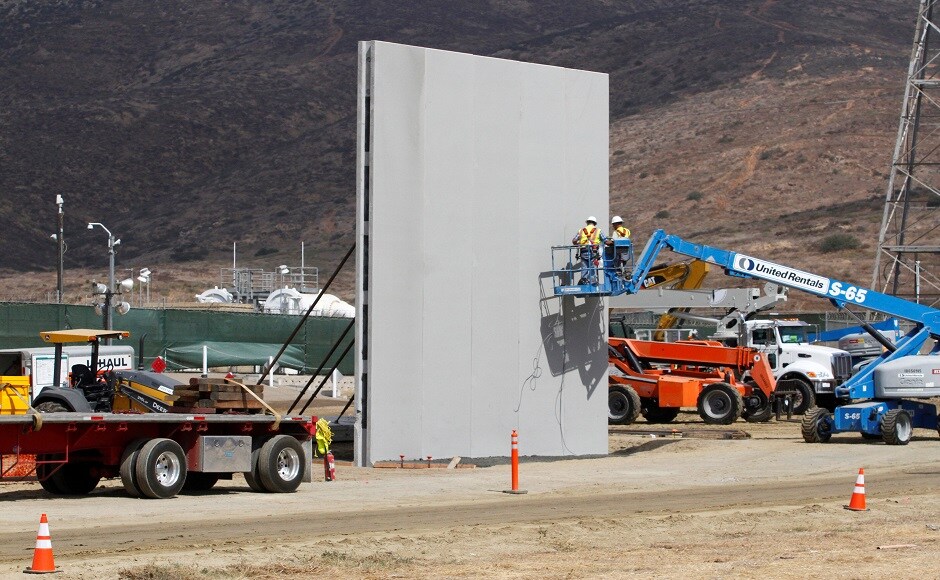 Six contractors from across the country were selected to build the eight prototypes, all of which will be completed this week. The builders paid attention to aesthetics in their bid to win lucrative contracts. One wall segment features deep-blue steel and another has a brick facade, standing in sharp contrast to the area’s existing border fence, a ramshackle structure of corrugated steel left over from the Vietnam War. Reuters Six contractors from across the country were selected to build the eight prototypes, all of which will be completed this week. The builders paid attention to aesthetics in their bid to win lucrative contracts. One wall segment features deep-blue steel and another has a brick facade, standing in sharp contrast to the area’s existing border fence, a ramshackle structure of corrugated steel left over from the Vietnam War. Reuters
