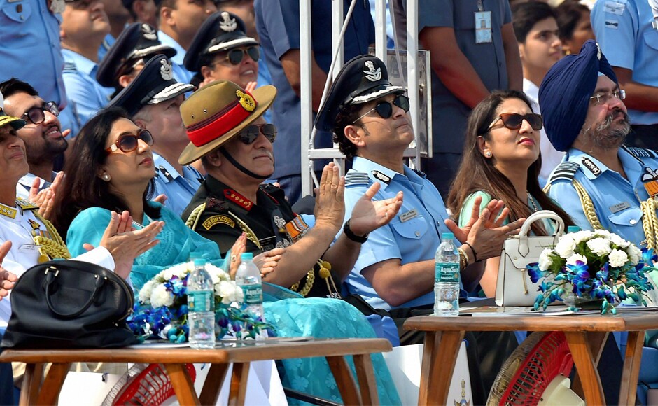 Air Chief Marshal BS Dhanoa (right), Captain of IAF, Sachin Tendulkar (centre), Army Chief General Bipin Rawat and others watch during the 85th Air Force Day parade at Hindon Air Force base in Ghaziabad on Sunday. PTI Stellar show adorns the skies at IAF's 85th Air Force Day parade in Ghaziabad