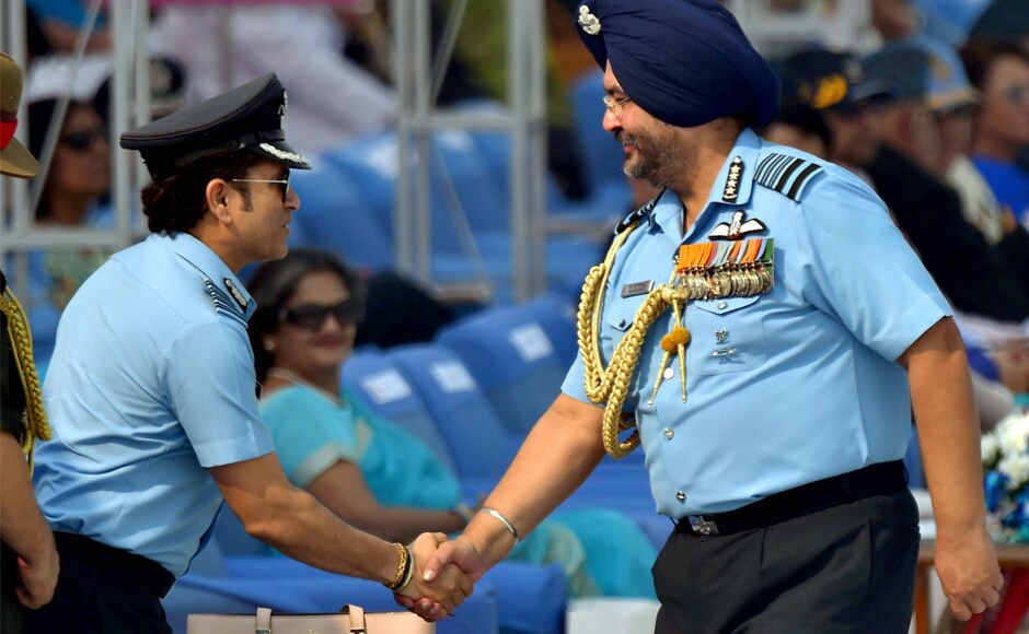 Captain of IAF, Sachin Tendulkar is greeted by Air Chief Marshal BS Dhanoa during the 85th Air Force Day parade on Sunday. PTI Stellar show adorns the skies at IAF's 85th Air Force Day parade in Ghaziabad