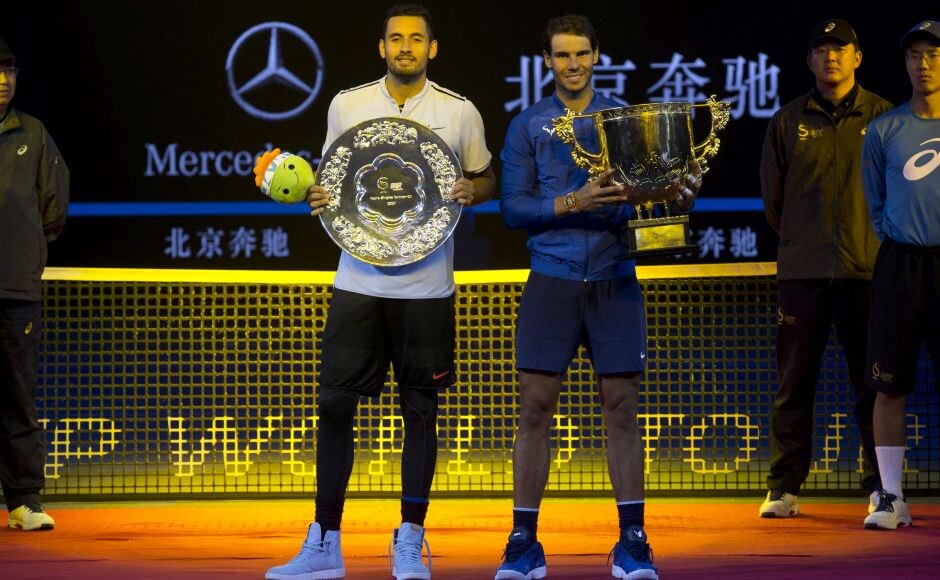 Rafael Nadal and Nick Kyrgios pose with their trophies after the men's singles final match. The last time Kyrgios played a No 1 it was also against Nadal. In that 2014 Wimbledon fourth-round encounter, the then 144th-ranked Kyrgios emerged a four-set winner. Nadal leads Kyrgios 3-2 in career meetings, and 2-1 this season. AP Rafael Nadal wins 6th title of year at China Open; Caroline Garcia upsets newly crowned World No 1 Simona Halep