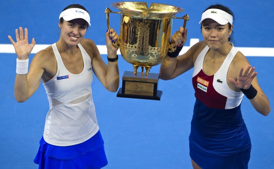 Martina Hingis and Chan Yung-Jan celebrate with their trophy after beating Timea Babos and Andrea Hlavackova after the final of the women's doubles. AP Rafael Nadal wins 6th title of year at China Open; Caroline Garcia upsets newly crowned World No 1 Simona Halep