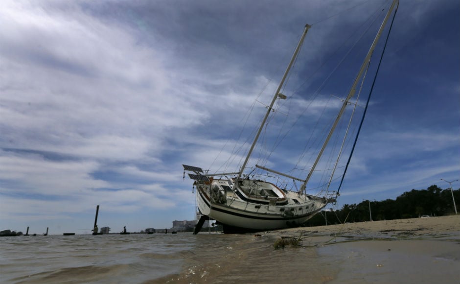 Nate's powerful winds pushed water onto roads and its winds knocked out power to more than 100,000 homes and businesses. Reuters Nate's powerful winds pushed water onto roads and its winds knocked out power to more than 100,000 homes and businesses. Reuters